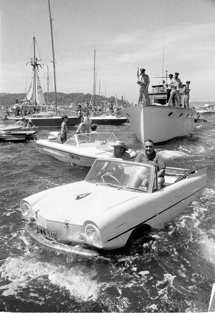 A gathering of boats, including one that looks like a car.