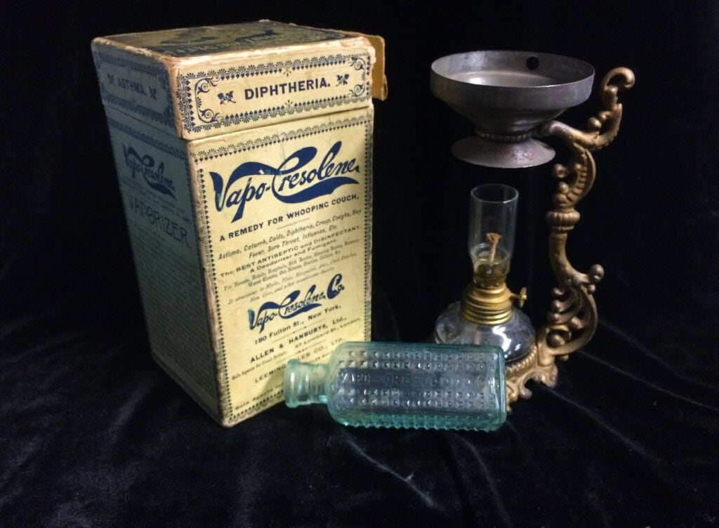 Vapo-Cresolene product box next to the vaporizer. 
